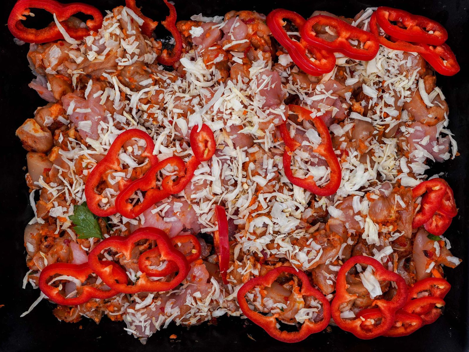 Straccetti di pollo e tacchino con peperoni e cipolla